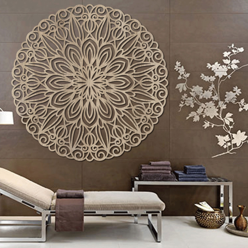 Carved wooden mandala on the wall, flower of...