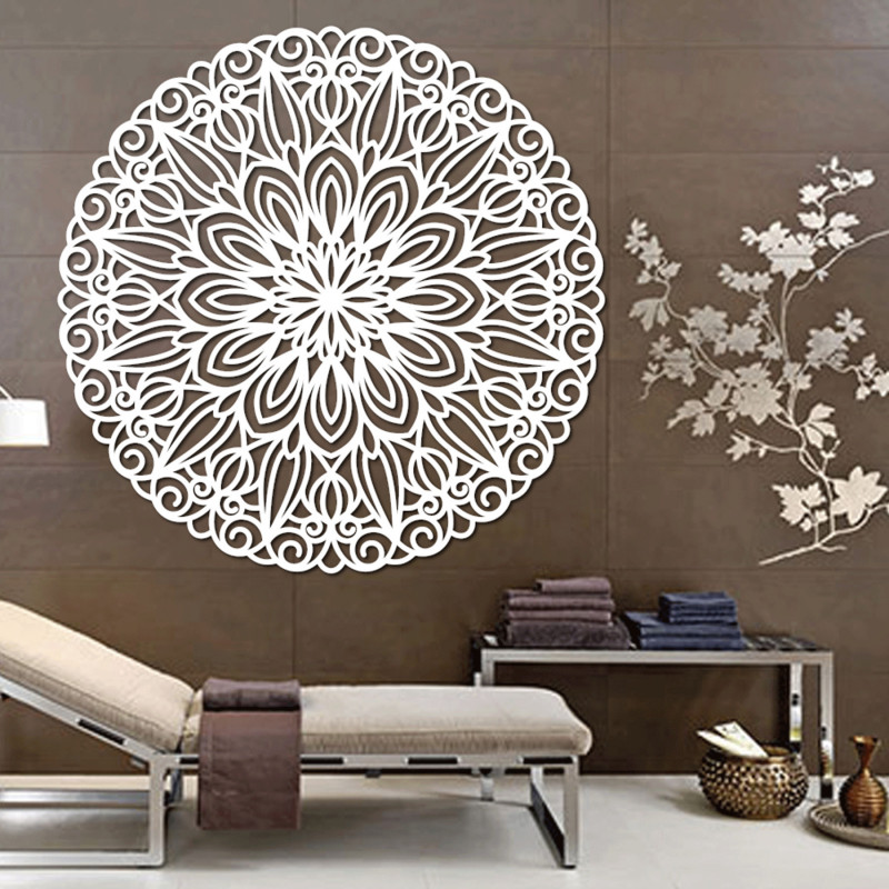 Carved wooden mandala on the wall, flower of...