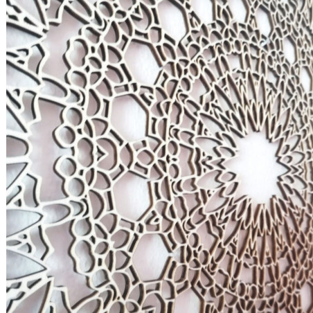 Designer mandala on the wall with a precise geometric pattern