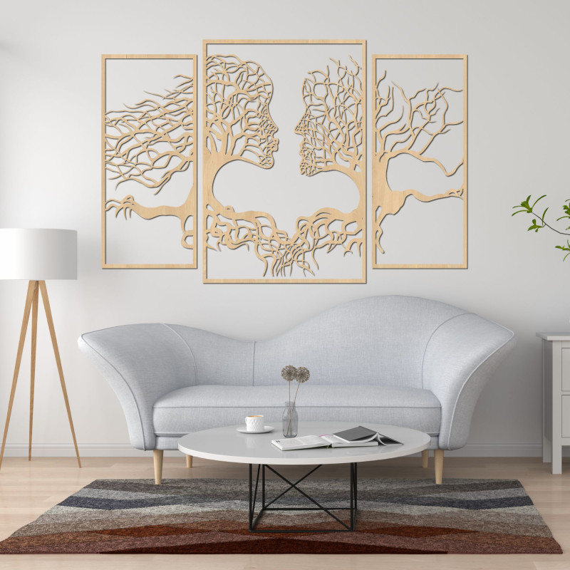 Wooden wall painting of faces and trees depicts the connection between man and nature