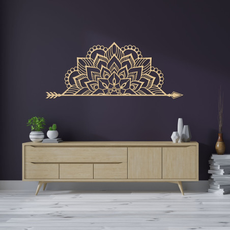 Wooden mandala on the wall with a delicate ornamental pattern as an elegant decoration for the interior