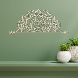 Wooden mandala on the wall with a delicate ornamental pattern as an elegant decoration for the interior