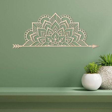 Wooden mandala on the wall with a delicate ornamental pattern as an elegant decoration for the interior