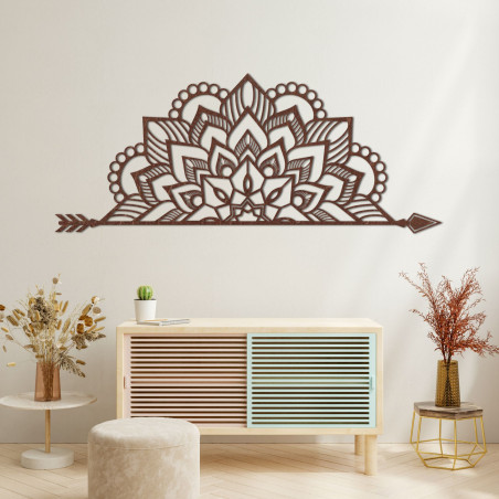 Wooden mandala on the wall with a delicate ornamental pattern as an elegant decoration for the interior