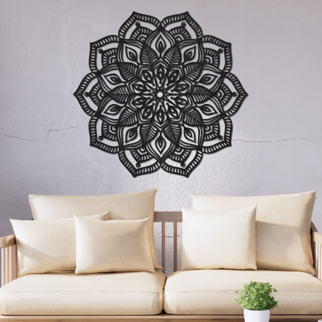 Wooden mandala on the wall with a detailed ornamental pattern for a modern interior