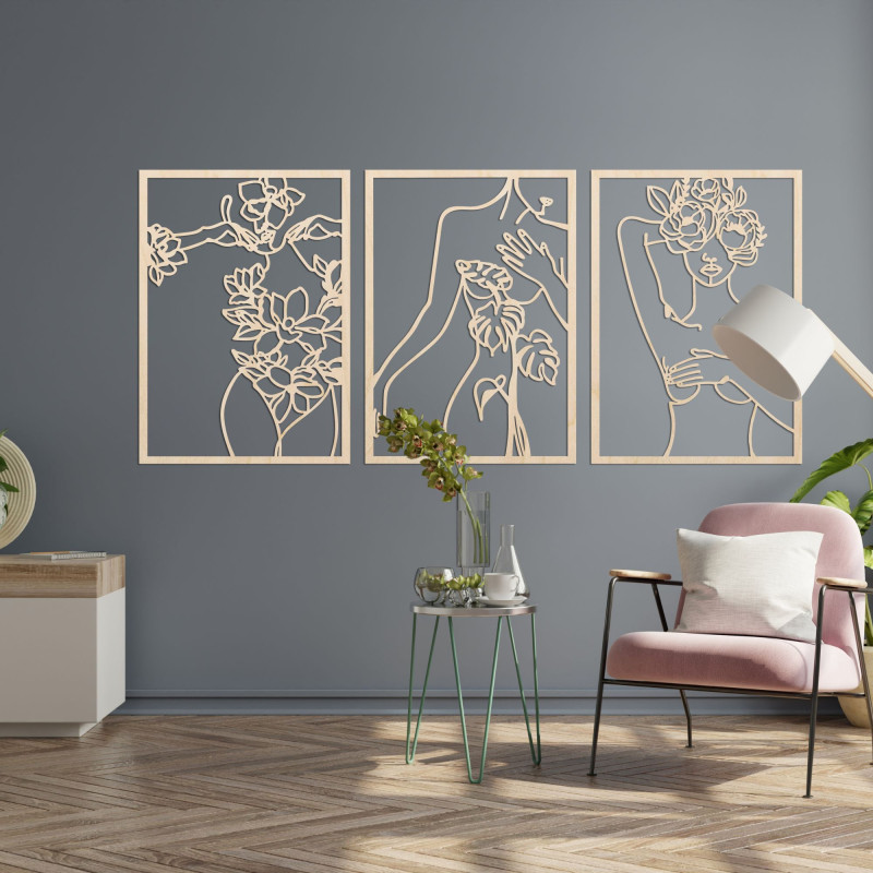 Elegant three-part painting of a woman with floral elements on the wall