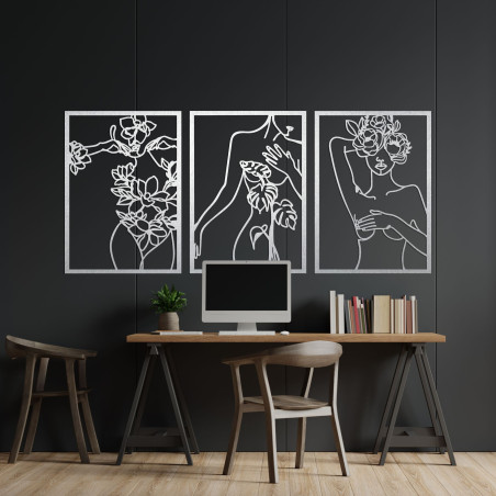 Elegant three-part painting of a woman with floral elements on the wall