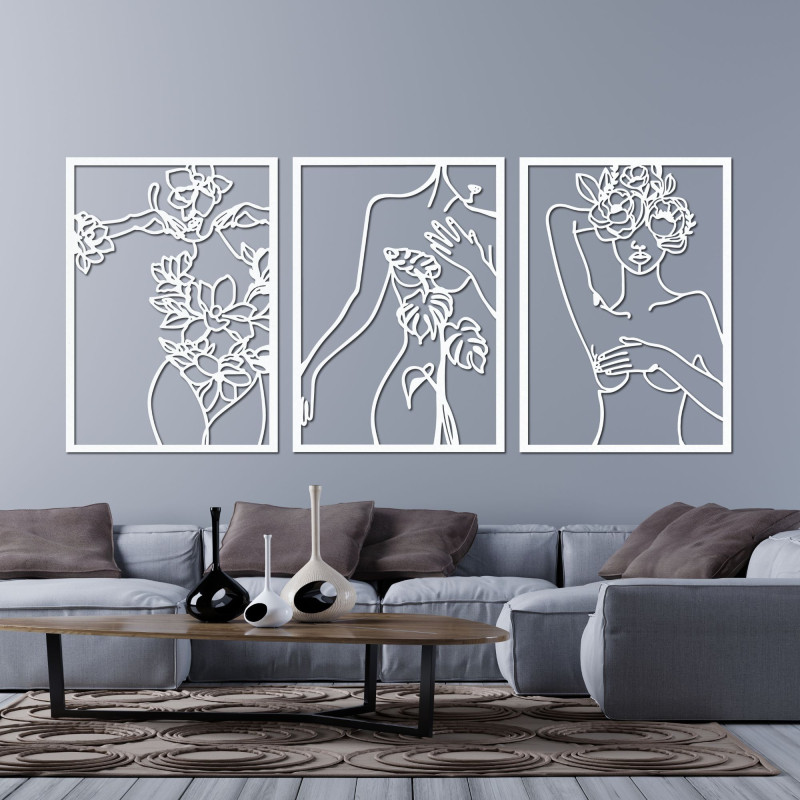 Elegant three-part painting of a woman with floral elements on the wall