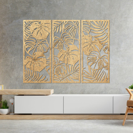 Modern wooden picture with tropical monstera leaves on the wall
