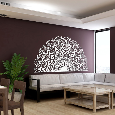 Luxurious wooden mandala on the wall in an elegant boho style interior