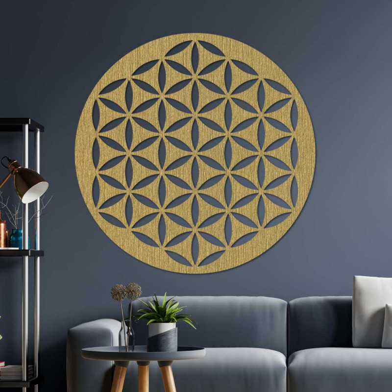 Wooden wall decoration with a geometric flower of life pattern displayed on a light wall.