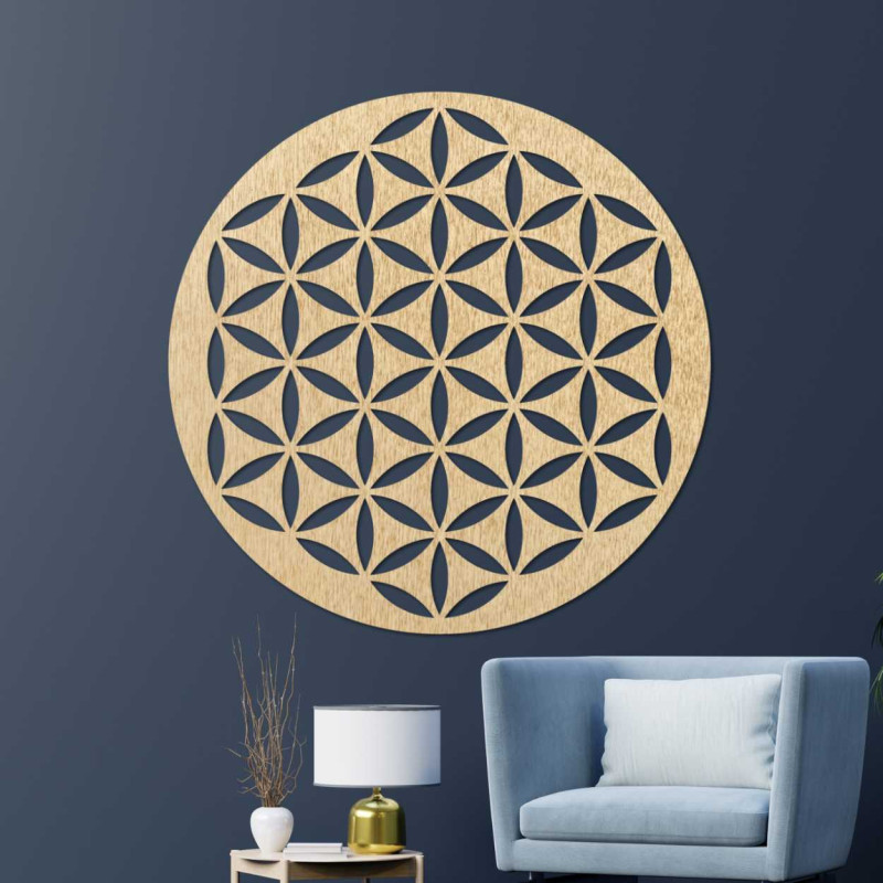 Wooden wall decoration with a geometric flower of life pattern displayed on a light wall.