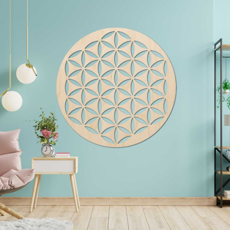 Wooden wall decoration with a geometric flower of life pattern displayed on a light wall.