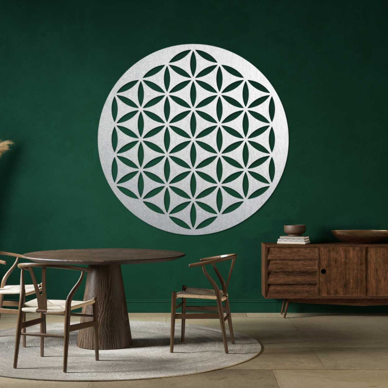 Wooden wall decoration with a geometric flower of life pattern displayed on a light wall.