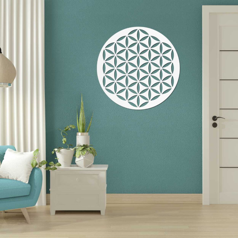Wooden wall decoration with a geometric flower of life pattern displayed on a light wall.