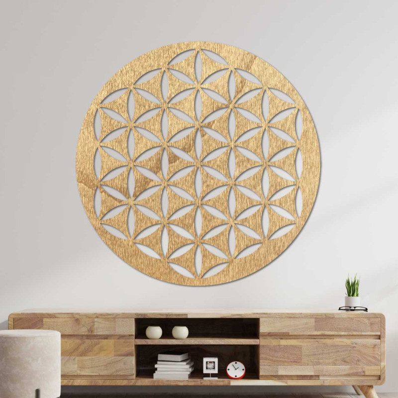 Wooden wall decoration with a geometric flower of life pattern displayed on a light wall.