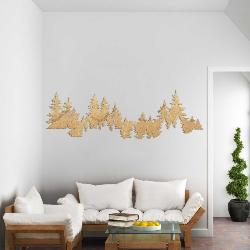 Close-up view of a forest silhouette made of wood mounted on a white wall.