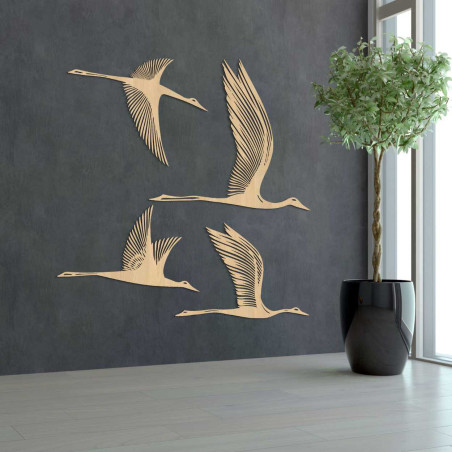 Wooden wall decoration with four flying birds in a minimalist style