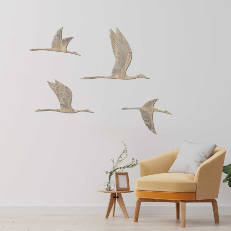 Elegant wooden birds fly in harmonious formation