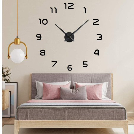 Large wall clock with separate digits mounted directly on the wall.
