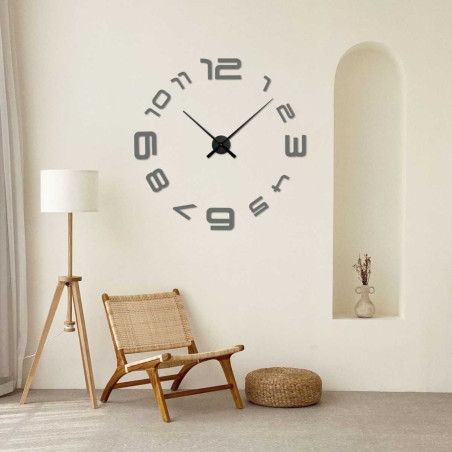 A wall clock with a simple arrangement of numbers and an elegant center point. A wall clock with a simple arrangement of numbers and an elegant center point.