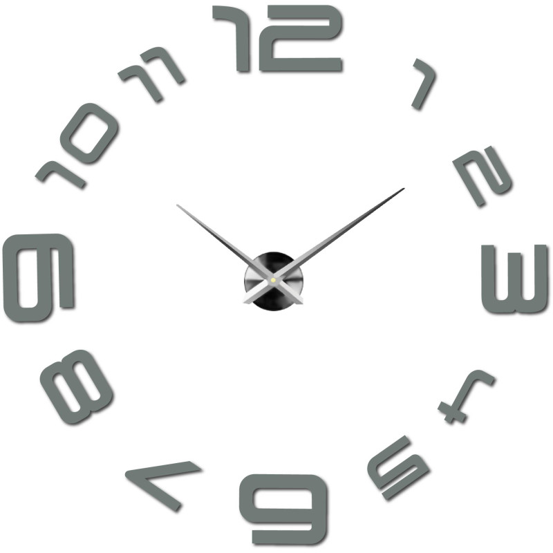 A wall clock with a large dial where the numbers are glued directly to the wall.