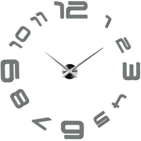 A wall clock with a large dial where the numbers are glued directly to the wall. A wall clock with a large dial where the numbers are glued directly to the wall.