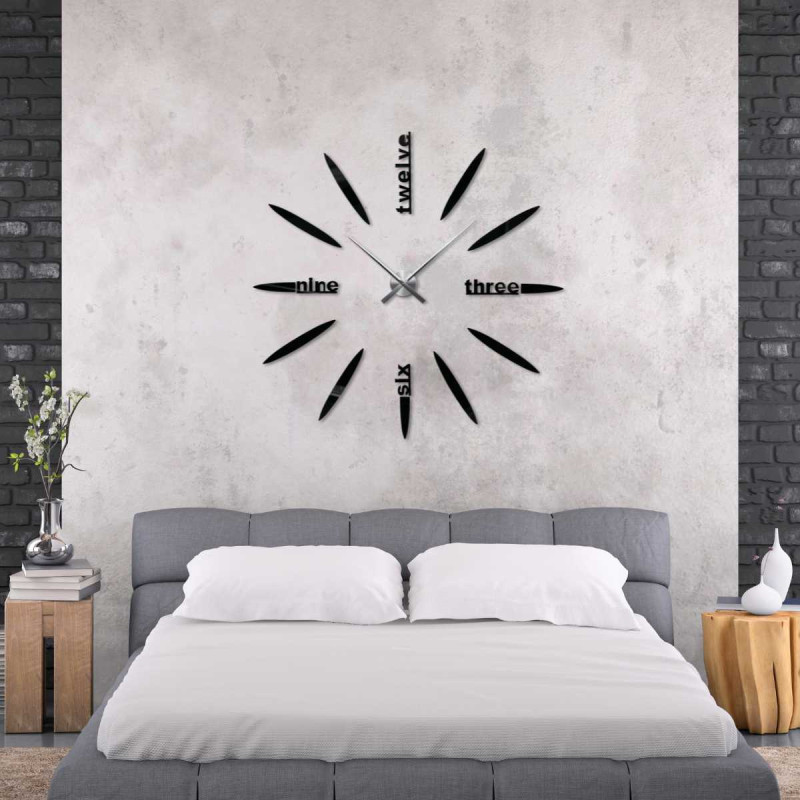 Detail of a 3D clock with a modern dial, oval elements and legible word inscriptions.