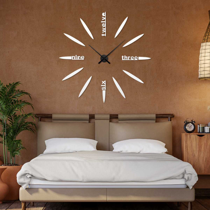 Detail of a 3D clock with a modern dial, oval elements and legible word inscriptions.