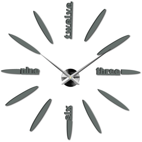 Modern 3D wall clock with inscriptions instead of numbers and a minimalist design. Modern 3D wall clock with inscriptions instead of numbers and a minimalist design.