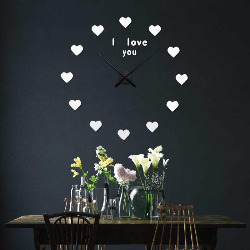 Romantic wall clock with hearts instead of numbers and the inscription "I love you" at the top of the dial.