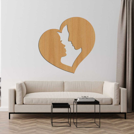 The profile of a man and a woman delicately carved into a heart frame as a symbol of union.