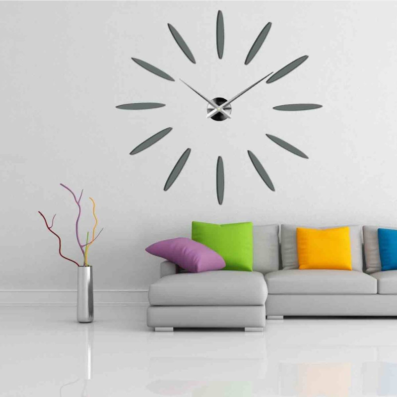 Wall clock with large gold indexes and silver hands, glued directly to the wall