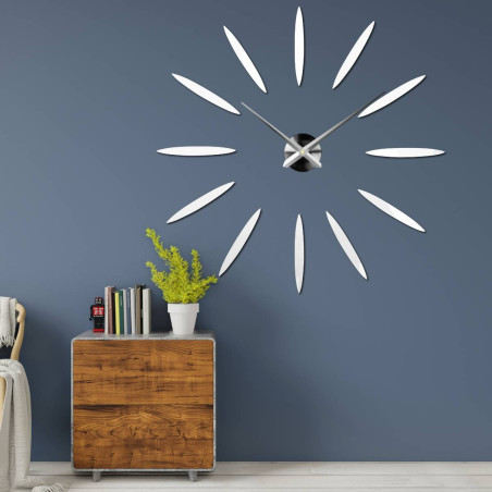 Modern clock with twelve mirror elements in gold color, without numbers. Modern clock with twelve mirror elements in gold color, without numbers.
