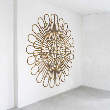 A designer wall element with a floral pattern made of natural material. A designer wall element with a floral pattern made of natural material.