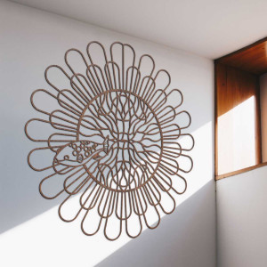 A wall element with delicate arches arranged in the shape of a blooming flower.