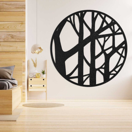 Design circle made of wood with a branch pattern on a dark wall Design circle made of wood with a branch pattern on a dark wall