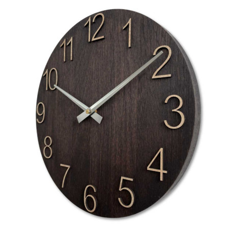 Wooden wall clock with carved numbers and metal hands.