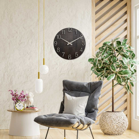 Round clock made of wood with a subtle, natural look.