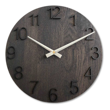 Round wooden clock with a subtle natural motif and legible numbers.