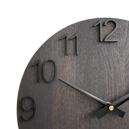 Round clock made of wood with a subtle, natural look.