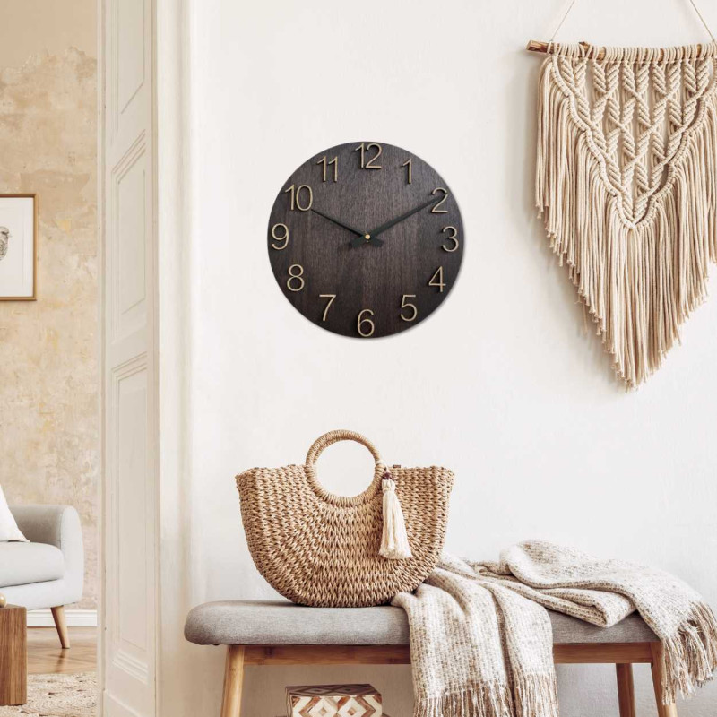 Simple wooden wall clock with contrasting hands.