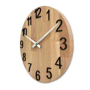 Round wooden clock with a subtle natural motif and legible numbers.