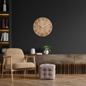 Wooden wall clock with carved numbers and metal hands.