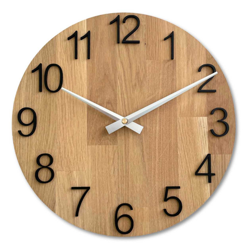 Round wooden clock with a subtle natural motif and legible numbers.