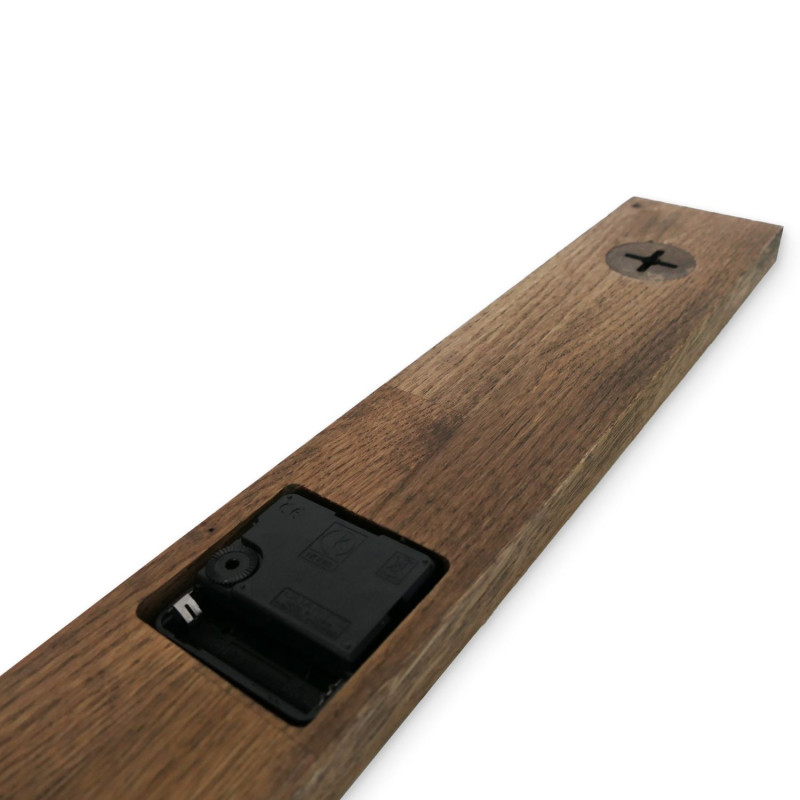 Minimalist wooden wall clock in black.