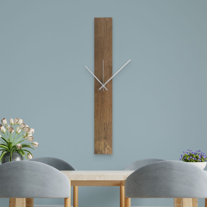 Modern wall clock made of wood in black with Arabic numerals.