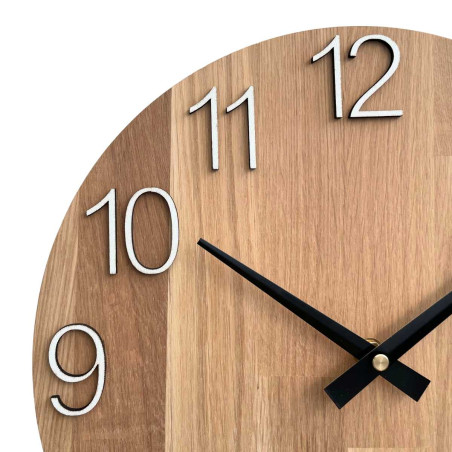 A shot of a clock face made of wood with a clean and simple look. A shot of a clock face made of wood with a clean and simple look.
