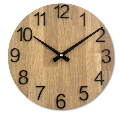 Wooden wall clock with a circular shape and a subtle natural motif. Wooden wall clock with a circular shape and a subtle natural motif.