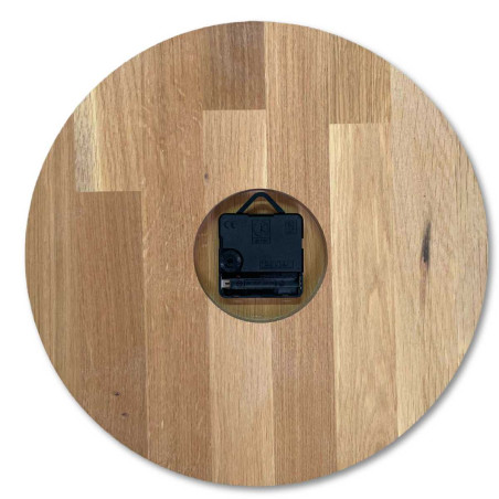 A shot of a clock face made of wood with a clean and simple look. A shot of a clock face made of wood with a clean and simple look.
